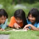 group children lying reading grass field 1150 3898